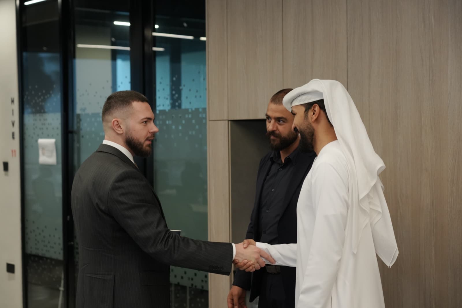 Advisor welcoming investor clients at the Onelink Solutions office